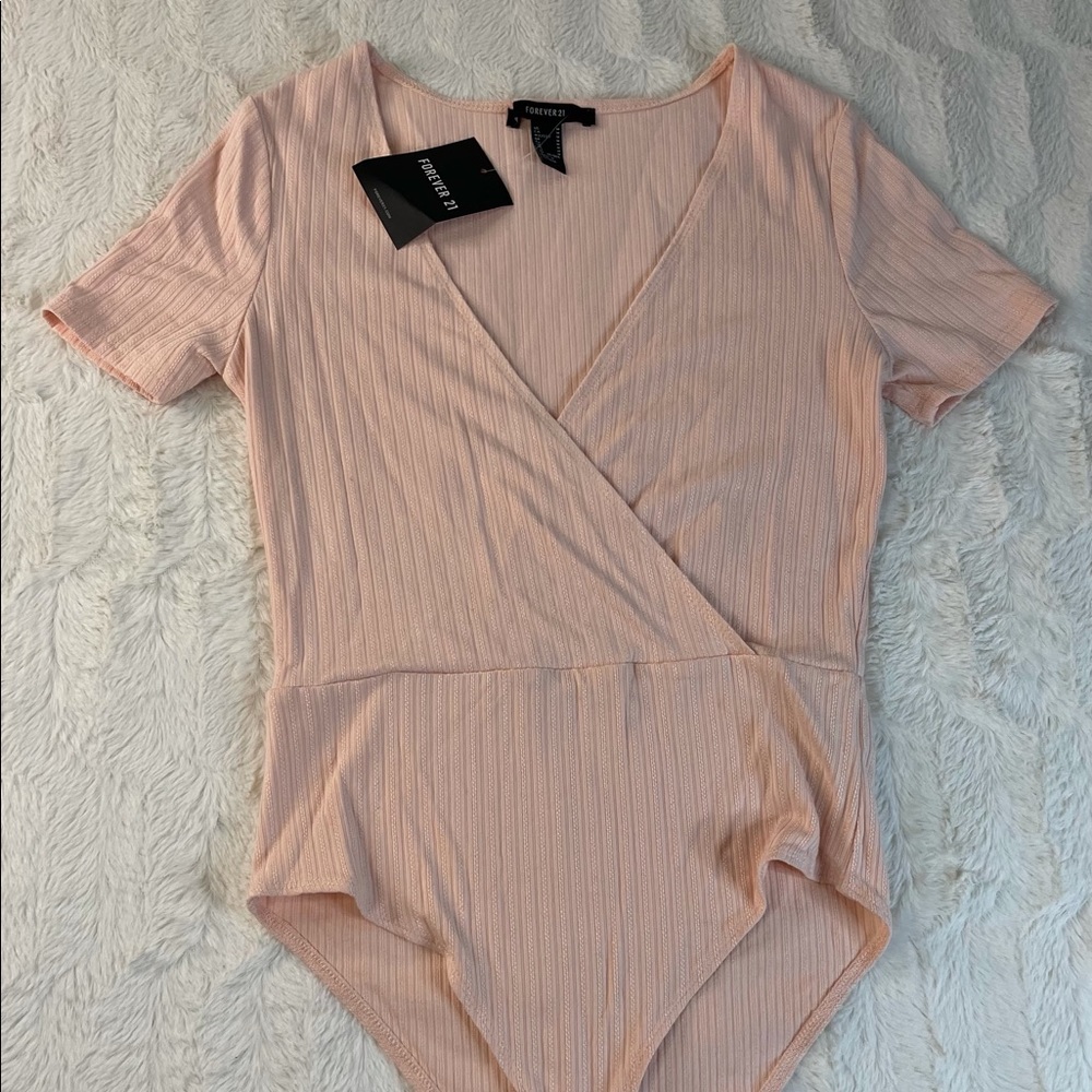 Forever 21 pink bodysuit brand new with tags size M
